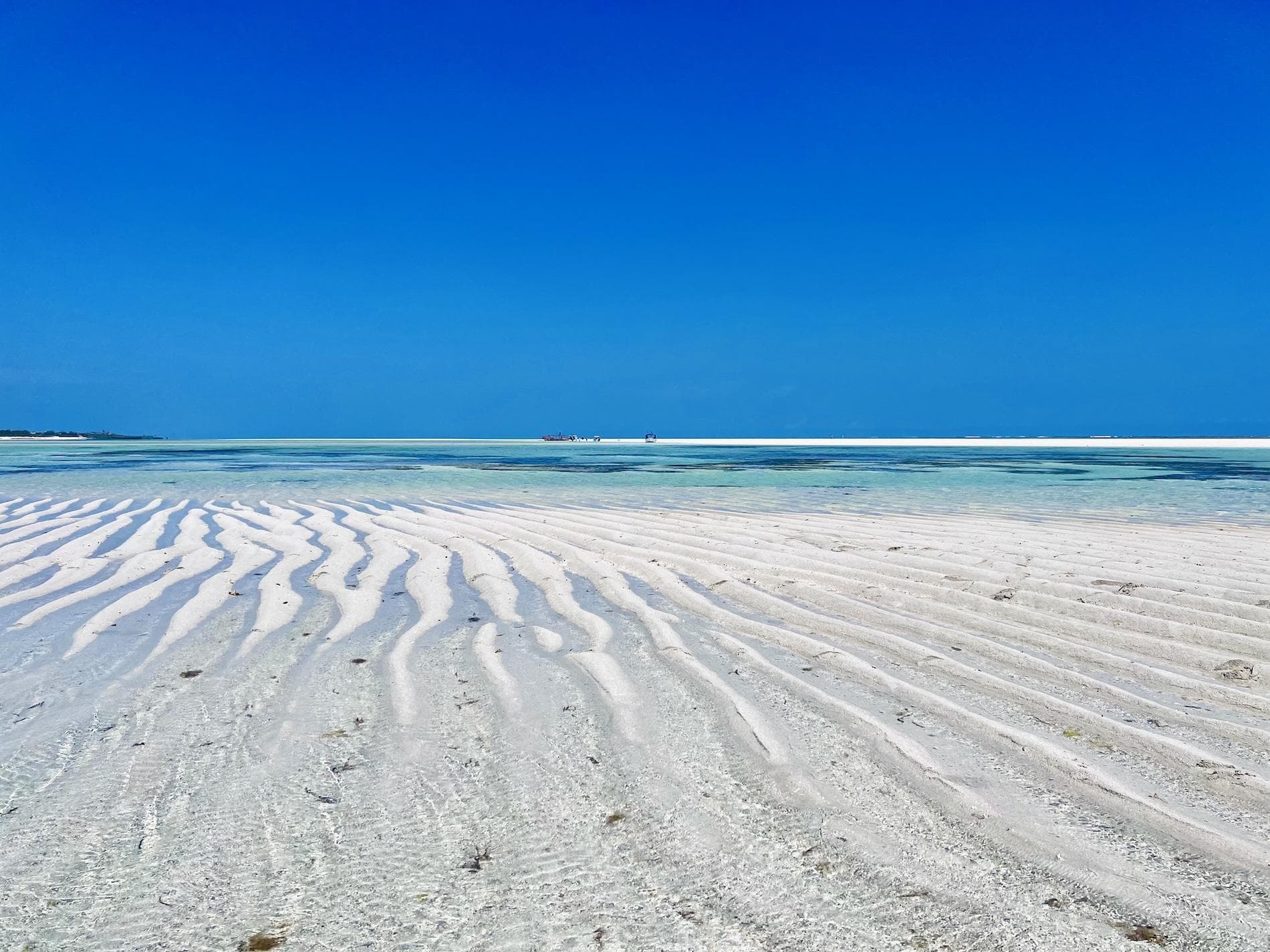 Rippled white sand banks at low tide on a Watamu beach, Kenya