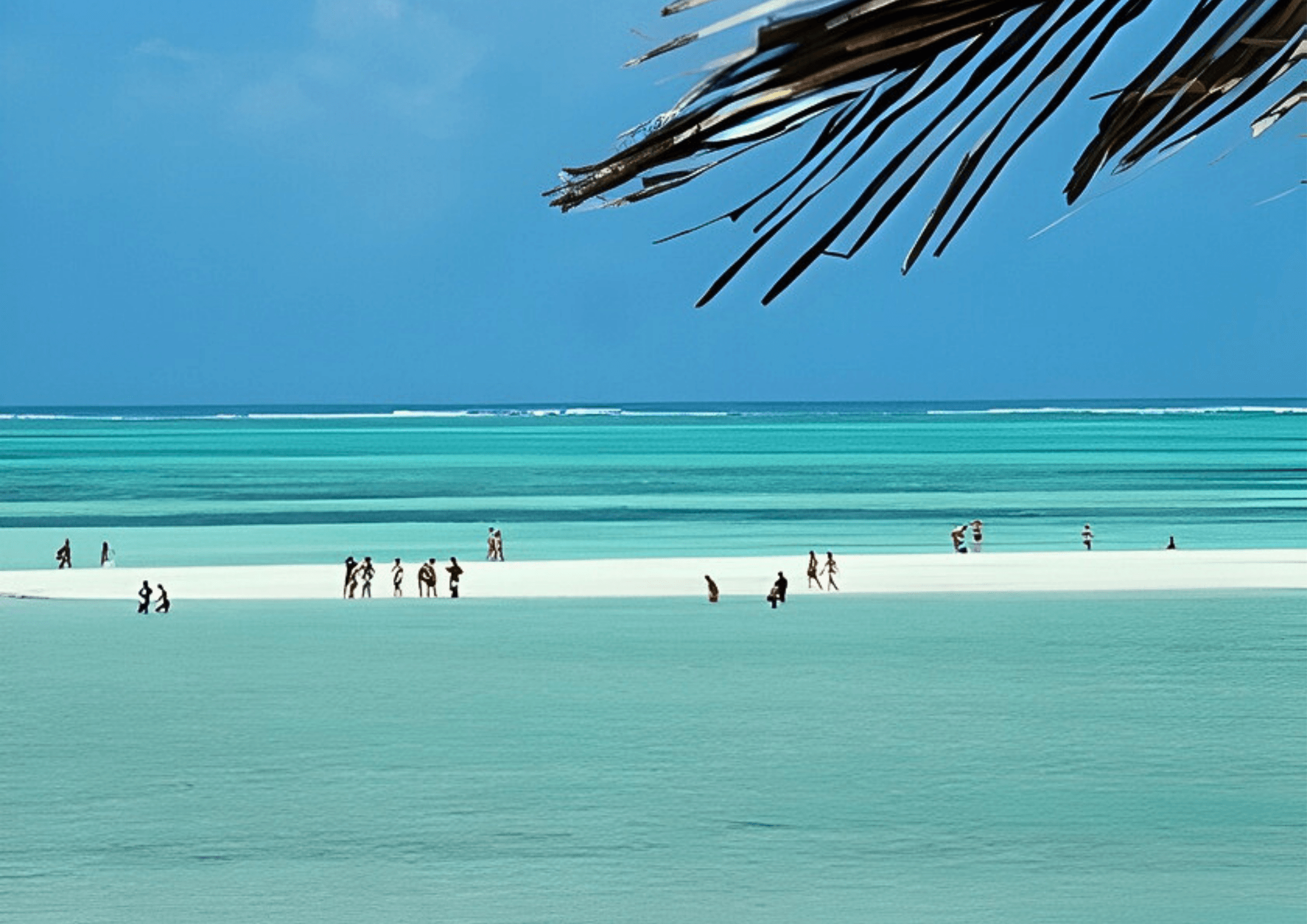 People walking on an exposed sandbank at low tide in Watamu, Kenya